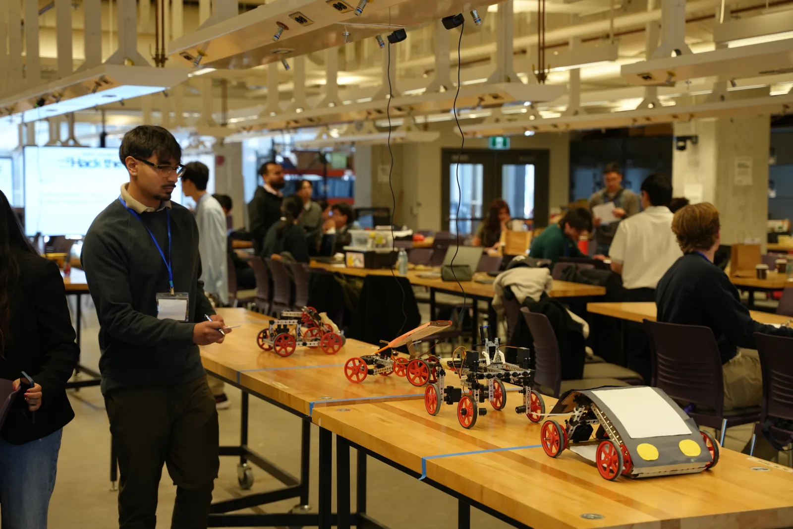 Engineering team working on the autonomous vehicle during Hack the Move